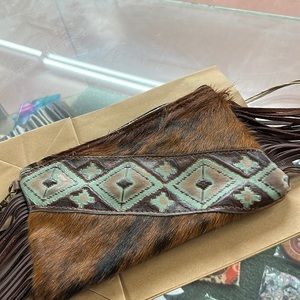 Cow hide tooled leather clutch